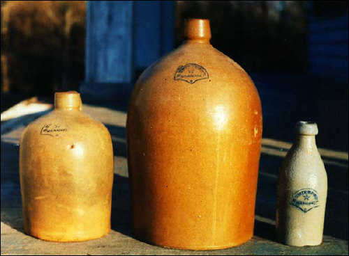 Stoneware jugs and beer bottles by C. Hermann & Co of Milwaukee